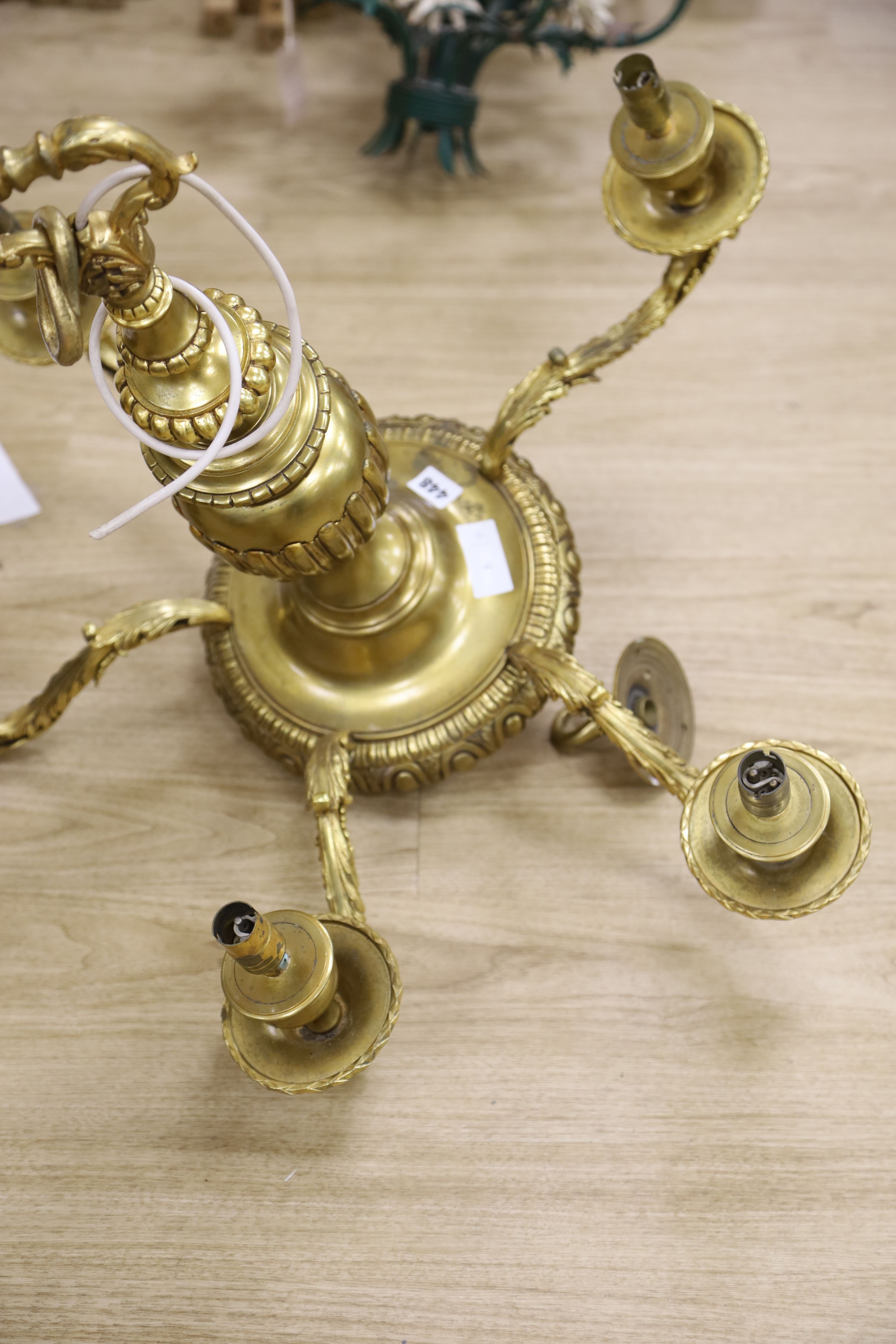 A Louis XIV style five branch solid brass chandelier, drop 65cm